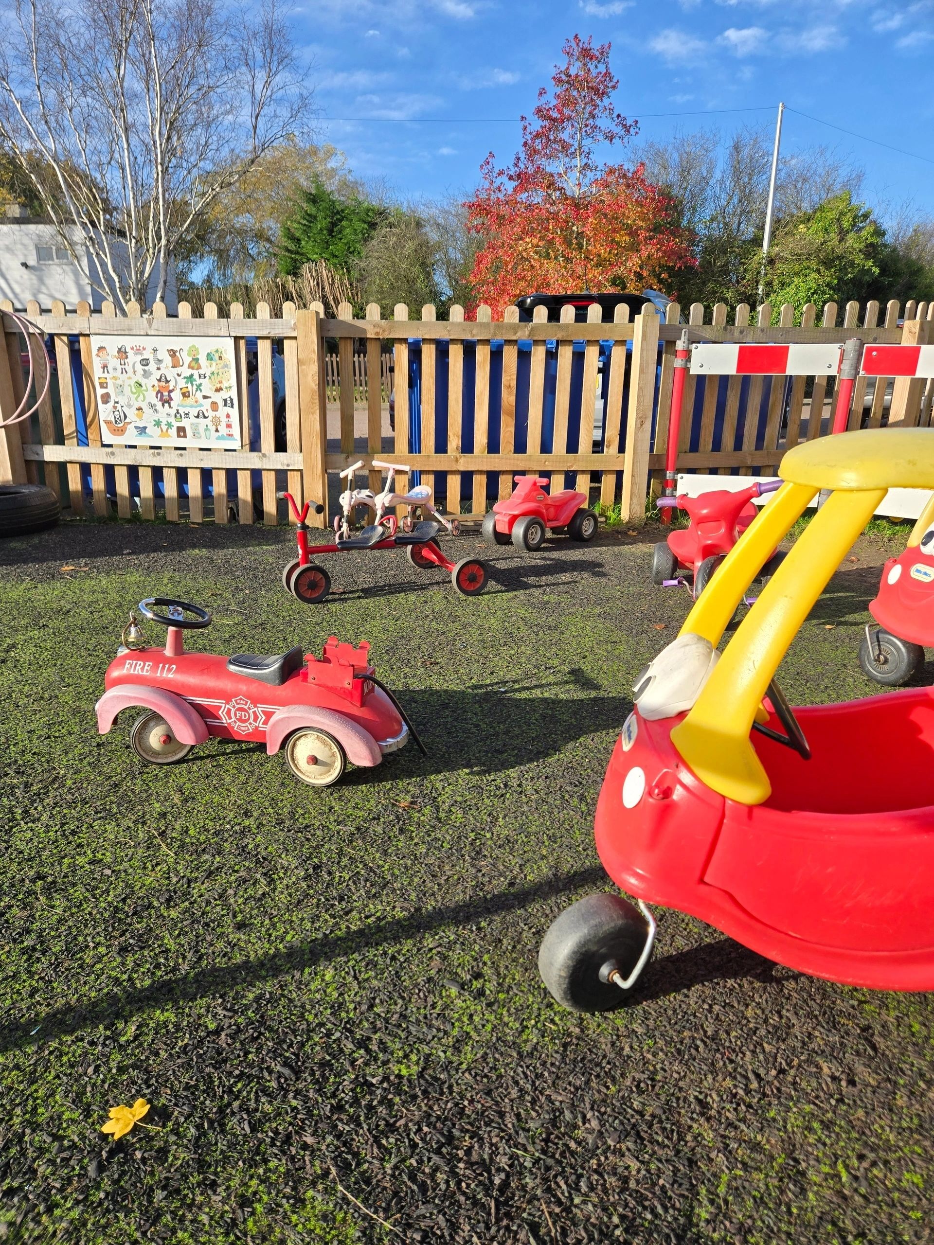 Children playing outdoors at Little Chums Nursery